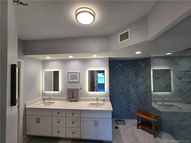 a bedroom with a bed a chair and a window