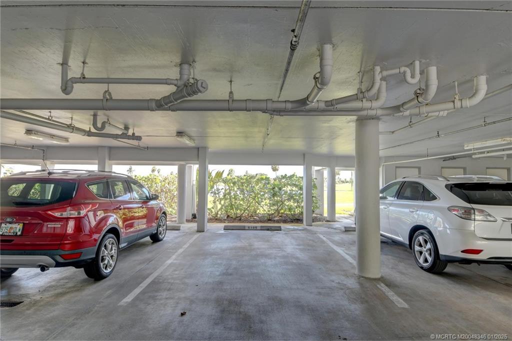 185 Northeast Edgewater Drive, Unit 5105 Stuart, FL 34996 - Photo 26 of 28 a car parked in a parking garage