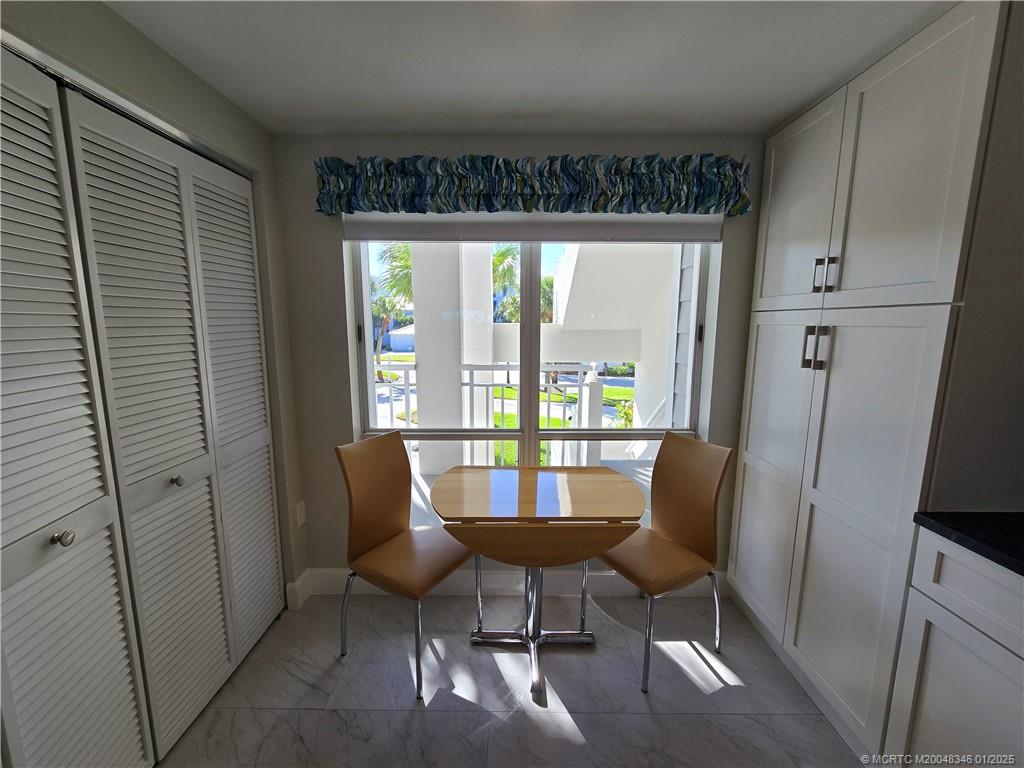 185 Northeast Edgewater Drive, Unit 5105 Stuart, FL 34996 - Photo 6 of 28 a view of a room with furniture and a window