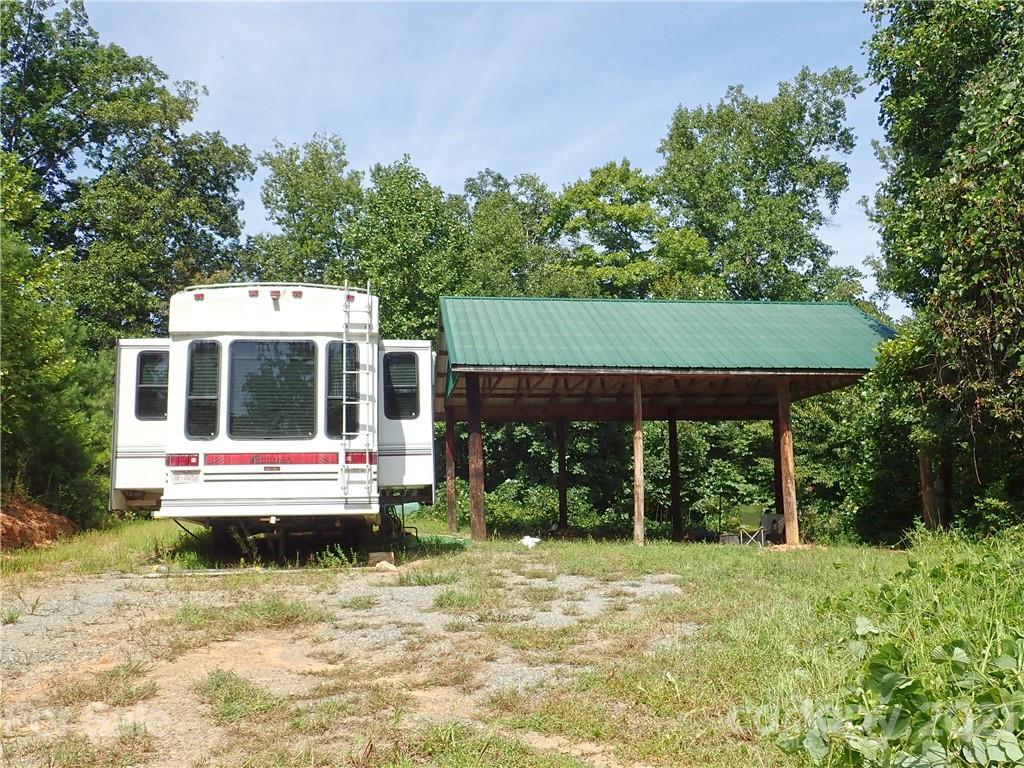 2915 Big Level Road Mill Spring, NC 28756 - Photo 4 of 26 a house view with a sitting space garden and outdoor space