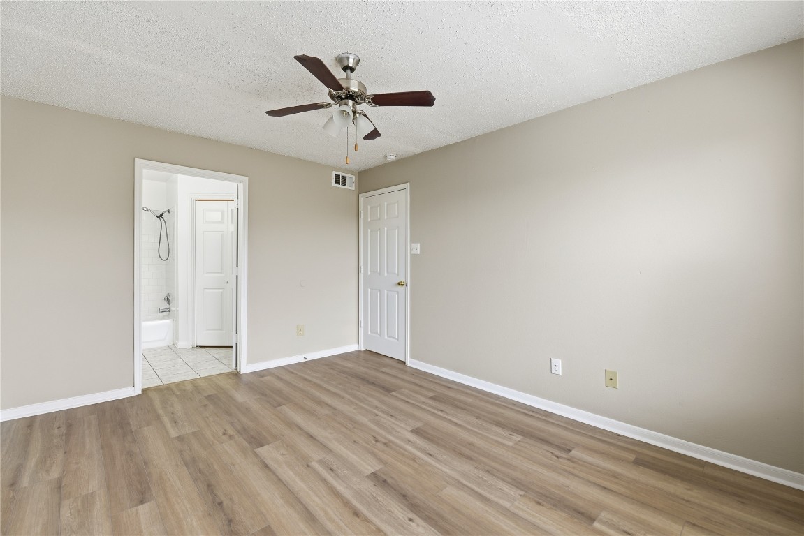 7718 Sign Street Houston, TX 77489 - Photo 12 of 24 wooden floor in an empty room