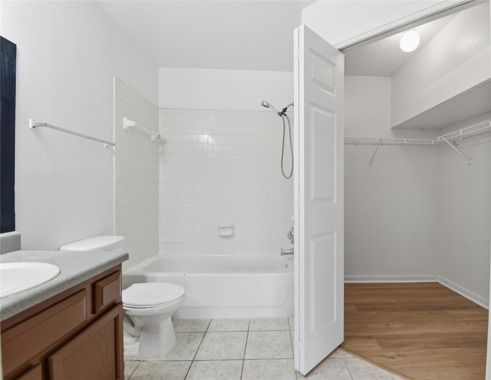 7718 Sign Street Houston, TX 77489 - Photo 15 of 24 a bathroom with a shower a toilet and sink