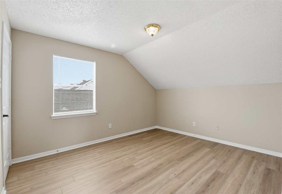 7718 Sign Street Houston, TX 77489 - Photo 16 of 24 wooden floor in an empty room