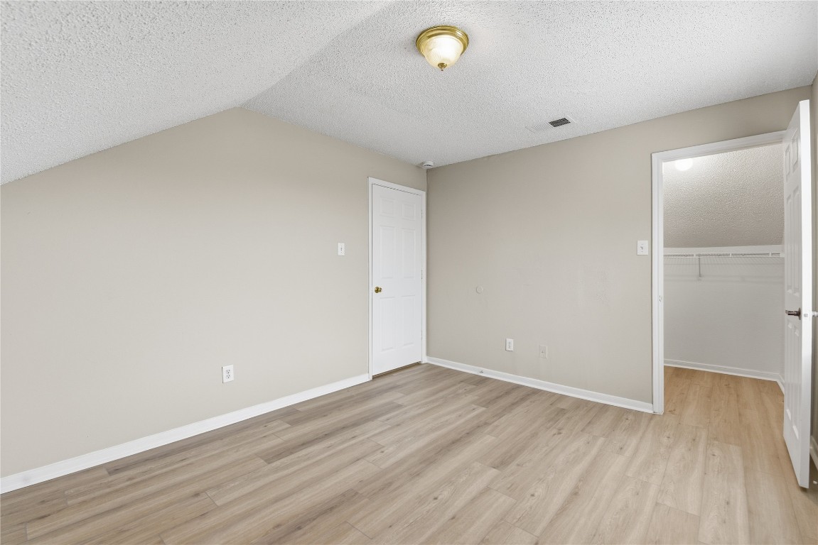 7718 Sign Street Houston, TX 77489 - Photo 17 of 24 a view of an empty room with wooden floor