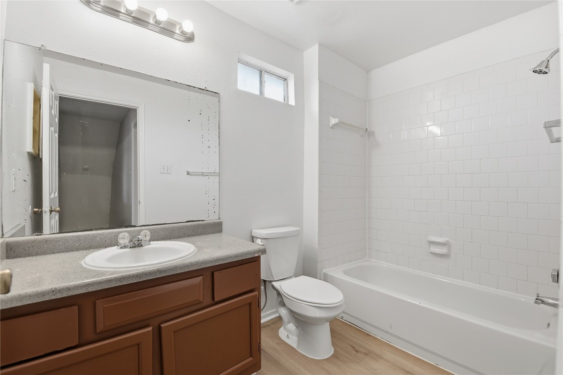 7718 Sign Street Houston, TX 77489 - Photo 21 of 24 a bathroom with a sink a toilet and shower