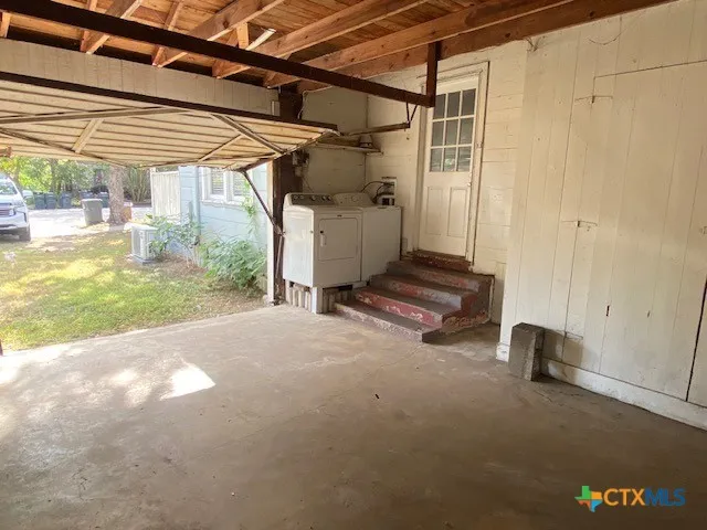 a view of a room with wooden walls