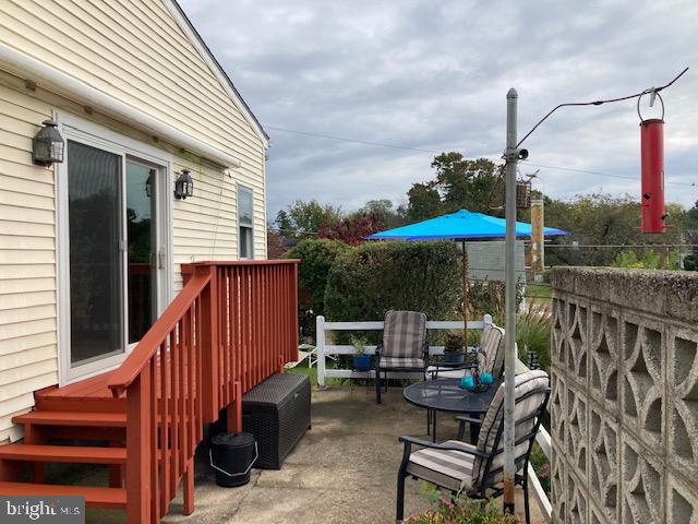 19 Beryl Road Paoli, PA 19301 - Photo 26 of 51 deck off Great Room to Patio w/ paver wall