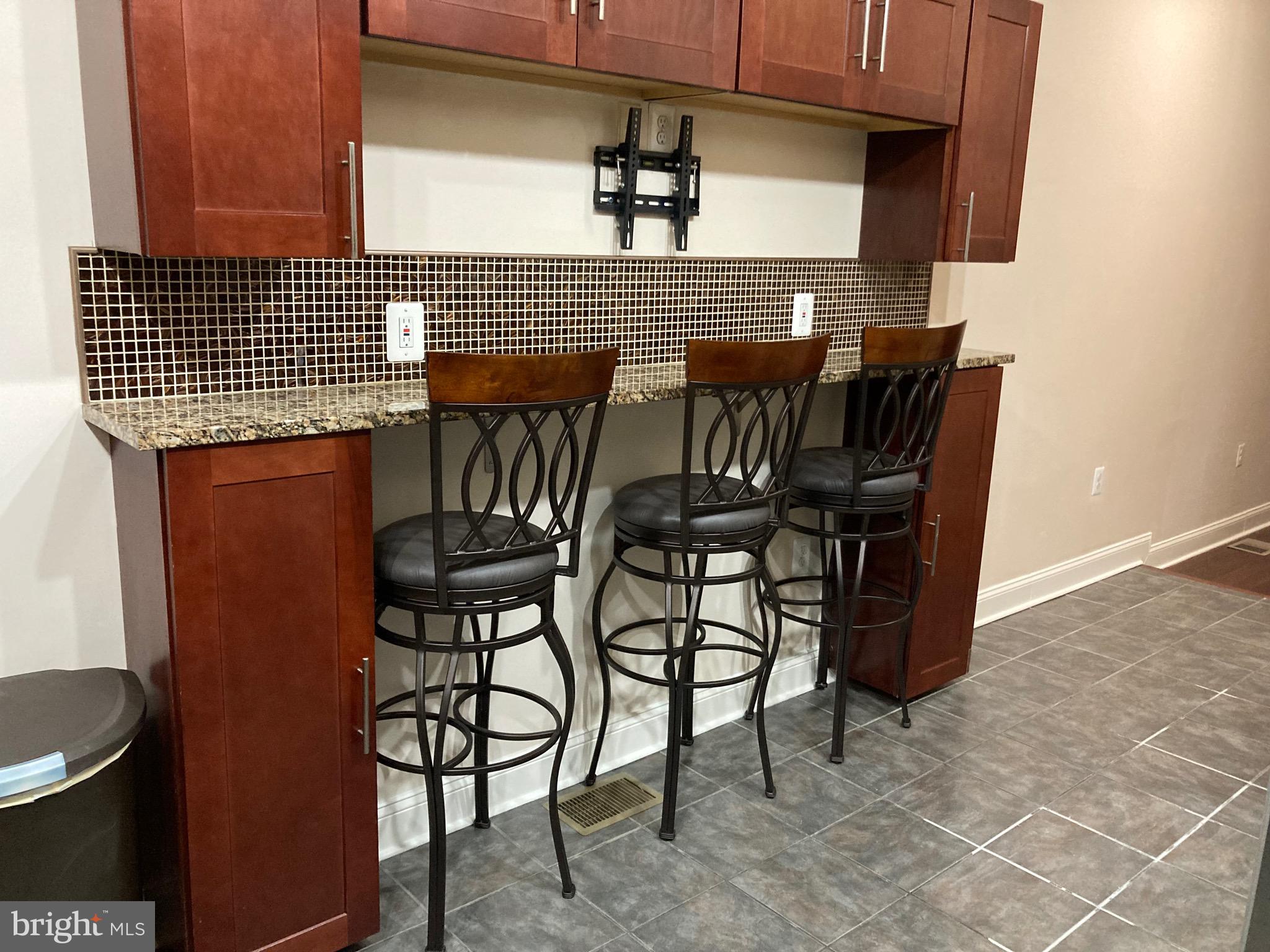 2225 Brookfield Avenue Baltimore, MD 21217 - Photo 20 of 28 a view of a dining room with furniture and wooden floor