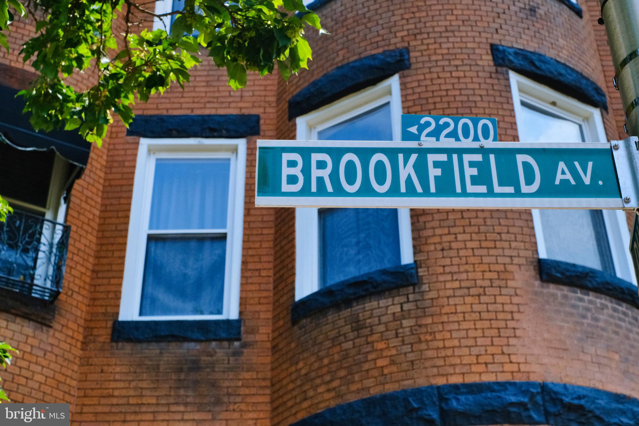 2225 Brookfield Avenue Baltimore, MD 21217 - Photo 2 of 28 a view of a wooden door and brick wall