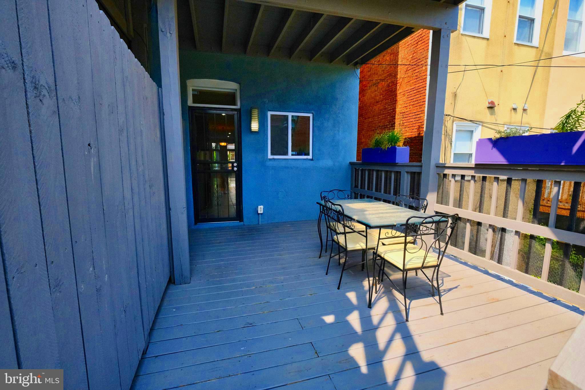 2225 Brookfield Avenue Baltimore, MD 21217 - Photo 25 of 28 a view of a chairs and table in the balcony