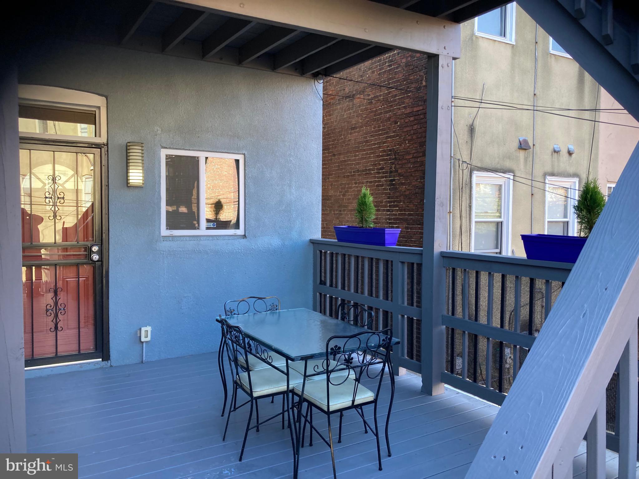 2225 Brookfield Avenue Baltimore, MD 21217 - Photo 26 of 28 a view of a livingroom with furniture window and wooden floor