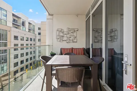 a view of a dining room and a table and chairs