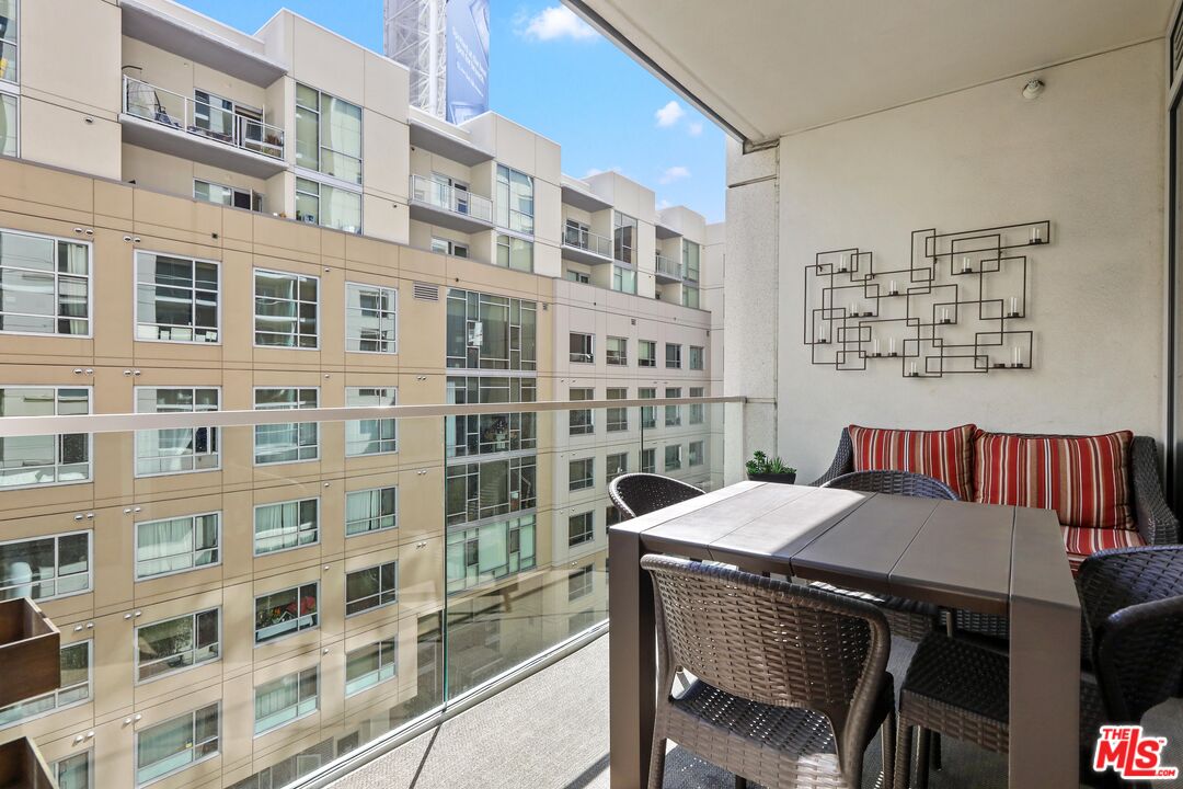 6250 Hollywood Boulevard, Unit 5J Los Angeles, CA 90028 - Photo 12 of 40 a view of a dining room and a table and chairs