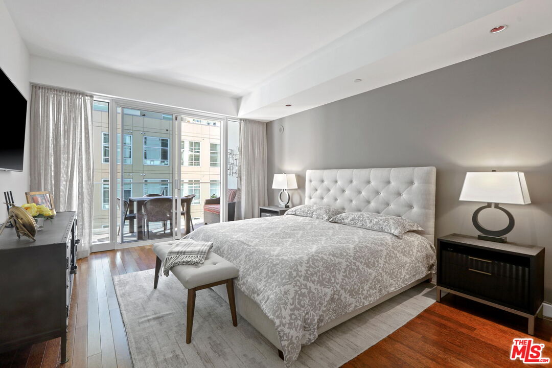 6250 Hollywood Boulevard, Unit 5J Los Angeles, CA 90028 - Photo 15 of 40 a bedroom with a bed and a table