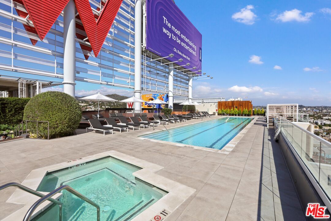 6250 Hollywood Boulevard, Unit 5J Los Angeles, CA 90028 - Photo 27 of 40 a swimming pool with outdoor seating and yard