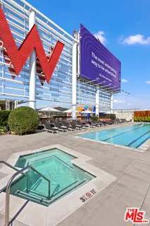 a view of a patio with a table and chairs