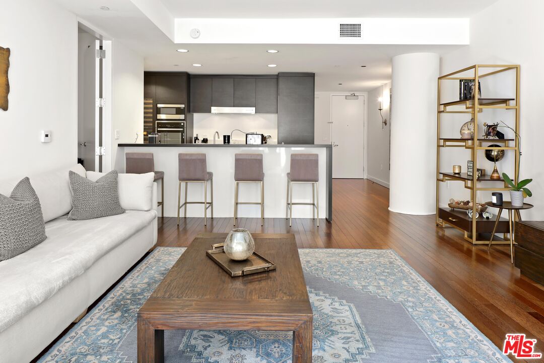 6250 Hollywood Boulevard, Unit 5J Los Angeles, CA 90028 - Photo 5 of 40 a living room with furniture and wooden floor