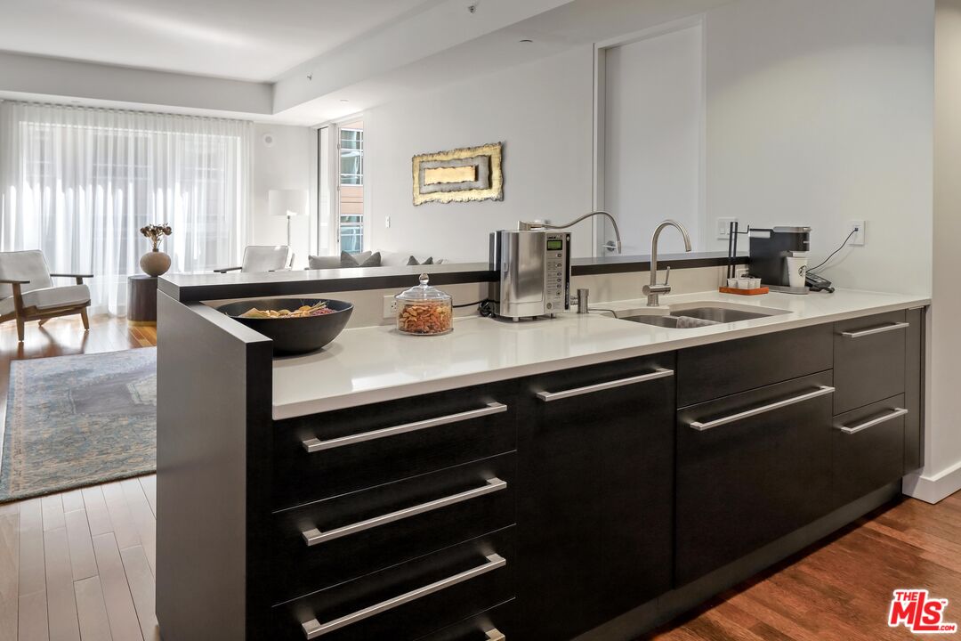 6250 Hollywood Boulevard, Unit 5J Los Angeles, CA 90028 - Photo 9 of 40 a kitchen with a sink appliances and a window