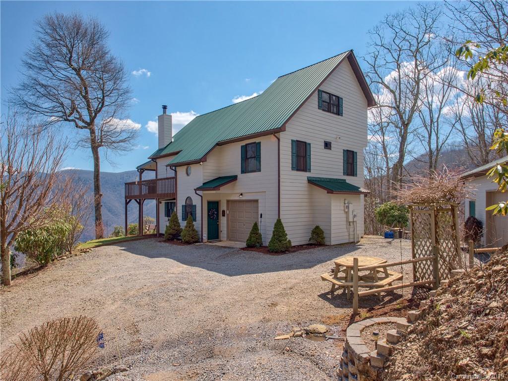464 Bent Tree Road Maggie Valley, NC 28751 - Photo 1 of 38 a view of a street with big house