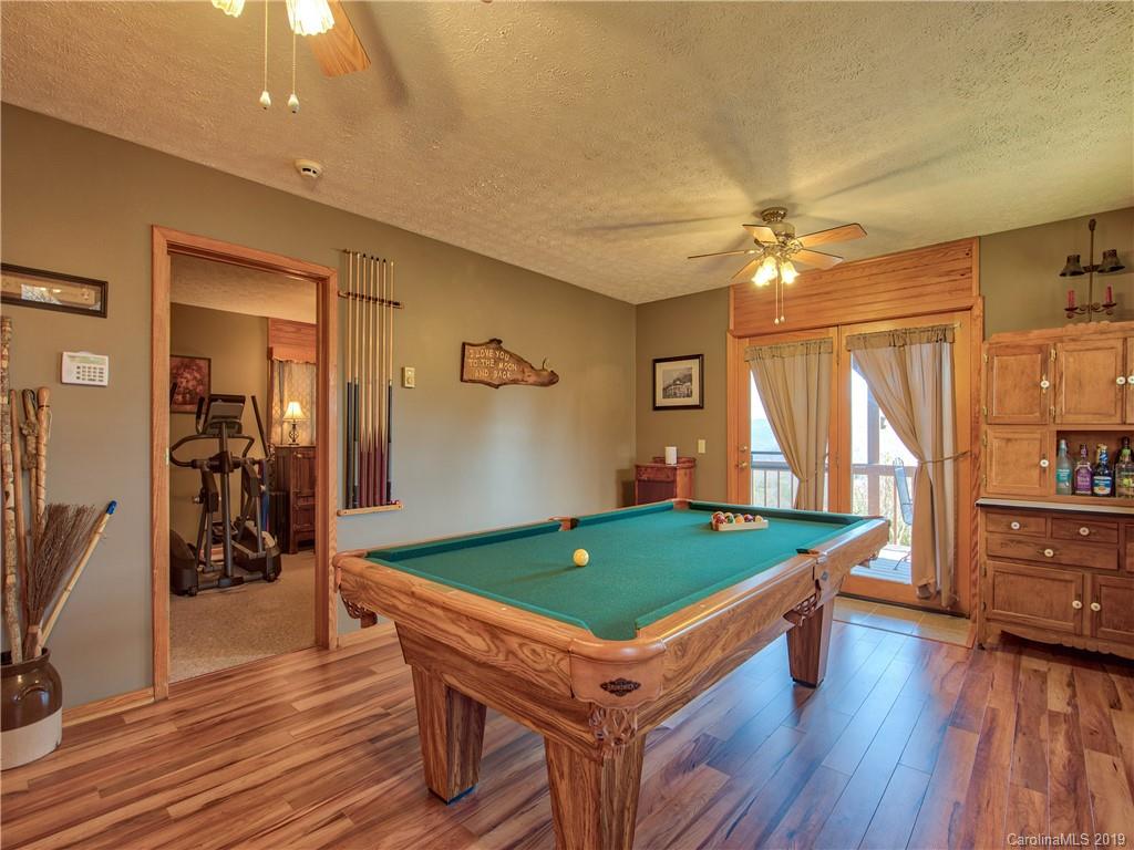 464 Bent Tree Road Maggie Valley, NC 28751 - Photo 19 of 38 a room with wooden floor pool table and windows