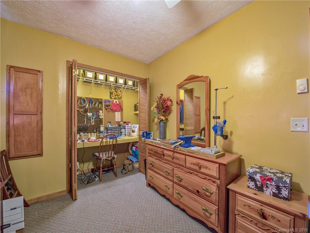 464 Bent Tree Road Maggie Valley, NC 28751 - Photo 22 of 38 a room with furniture and a mirror