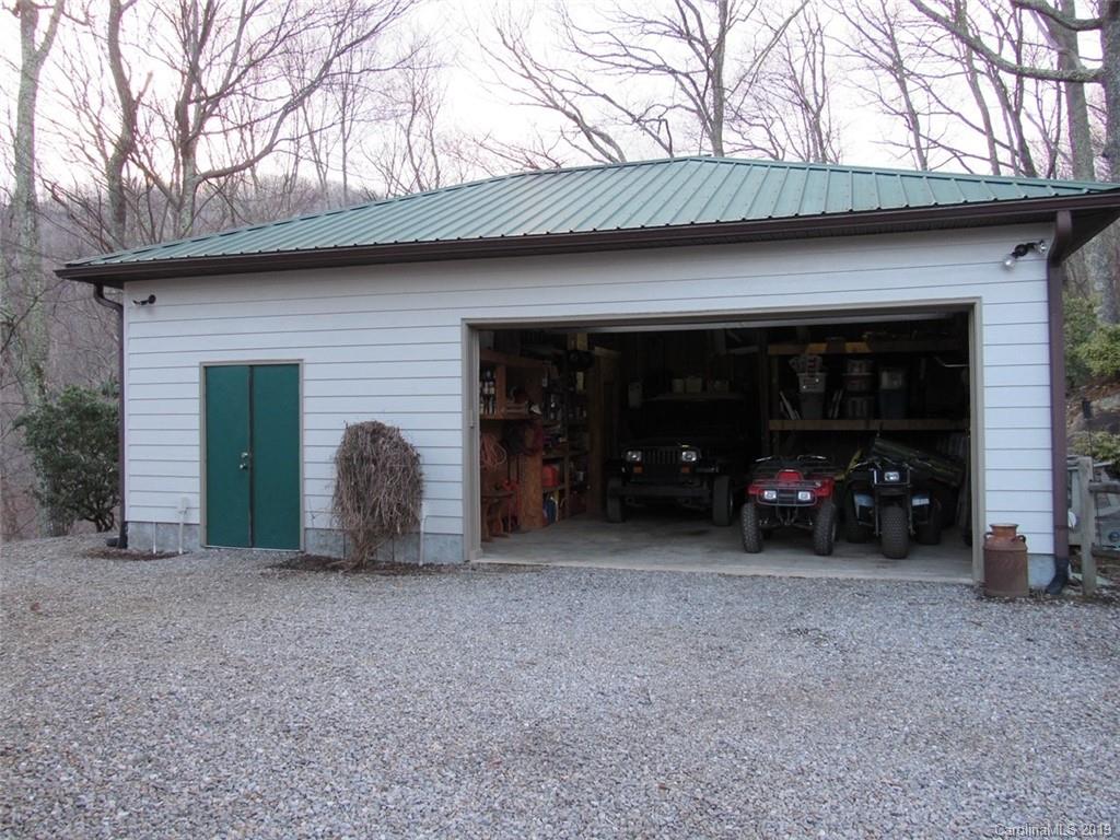 464 Bent Tree Road Maggie Valley, NC 28751 - Photo 23 of 38 a view of a house with large space and large trees