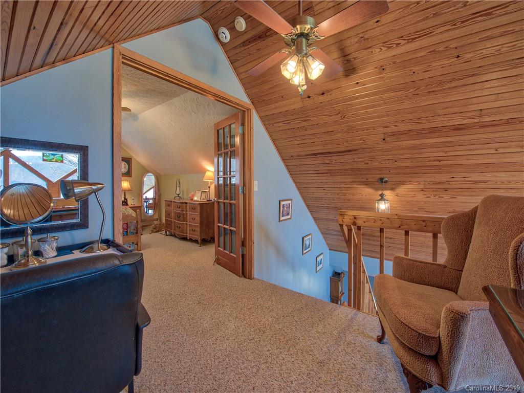 464 Bent Tree Road Maggie Valley, NC 28751 - Photo 9 of 38 a view of a livingroom with furniture and an entryway