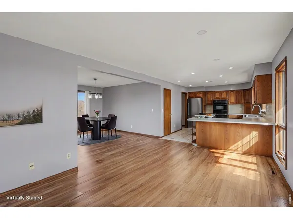 a kitchen with kitchen island a sink stainless steel appliances and cabinets