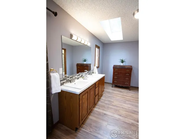 a bathroom with a sink double vanity and a mirror