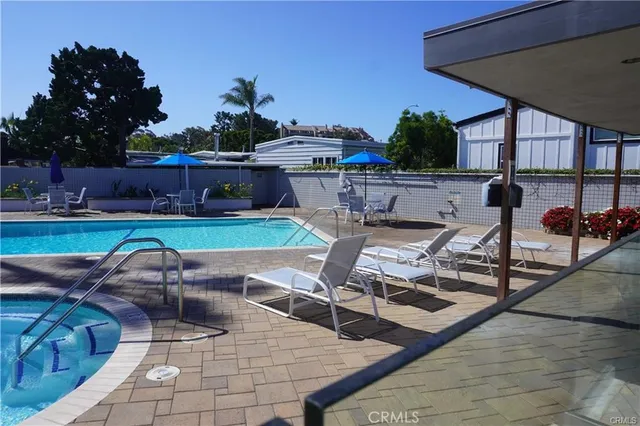 a view of a swimming pool with a lounge chairs
