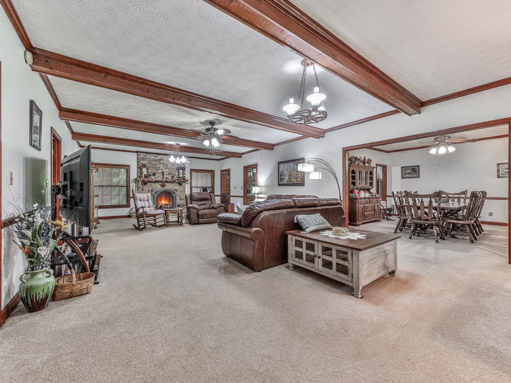 2760 Hembree Road Northeast Marietta, GA 30062 - Photo 11 of 65 a living room with furniture and a chandelier