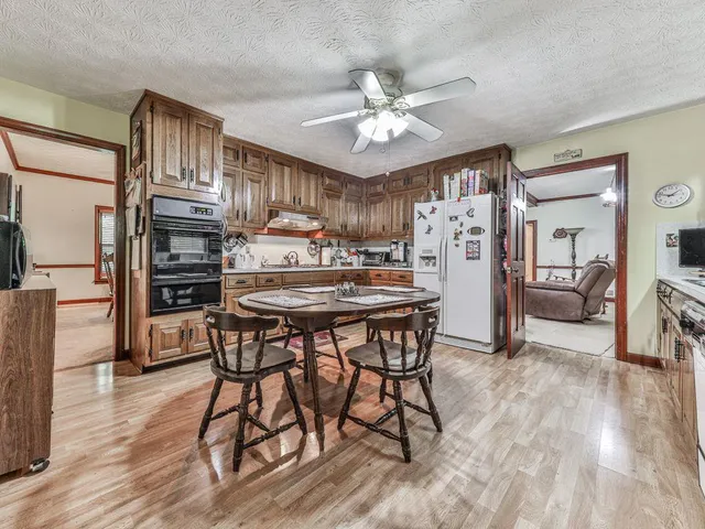 a kitchen with stainless steel appliances granite countertop a sink and cabinets