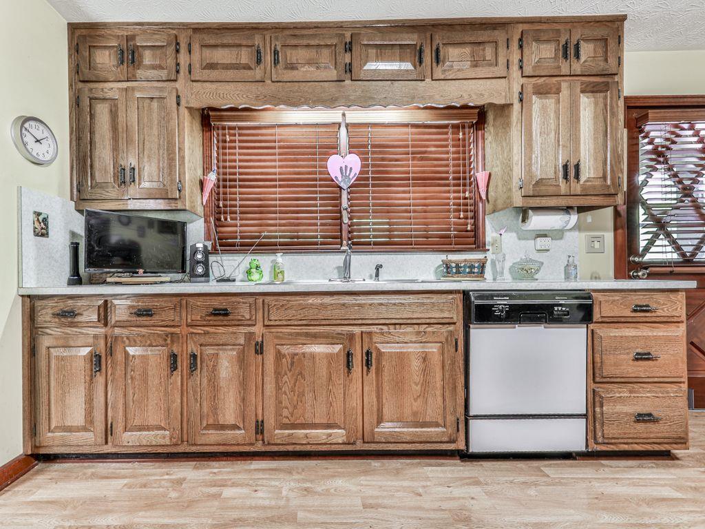2760 Hembree Road Northeast Marietta, GA 30062 - Photo 16 of 65 a kitchen with granite countertop a sink and a stove