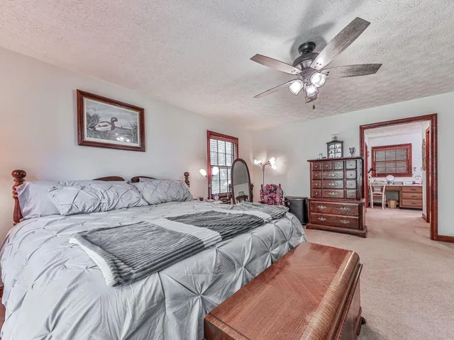 a bathroom with a toilet and a shower curtain