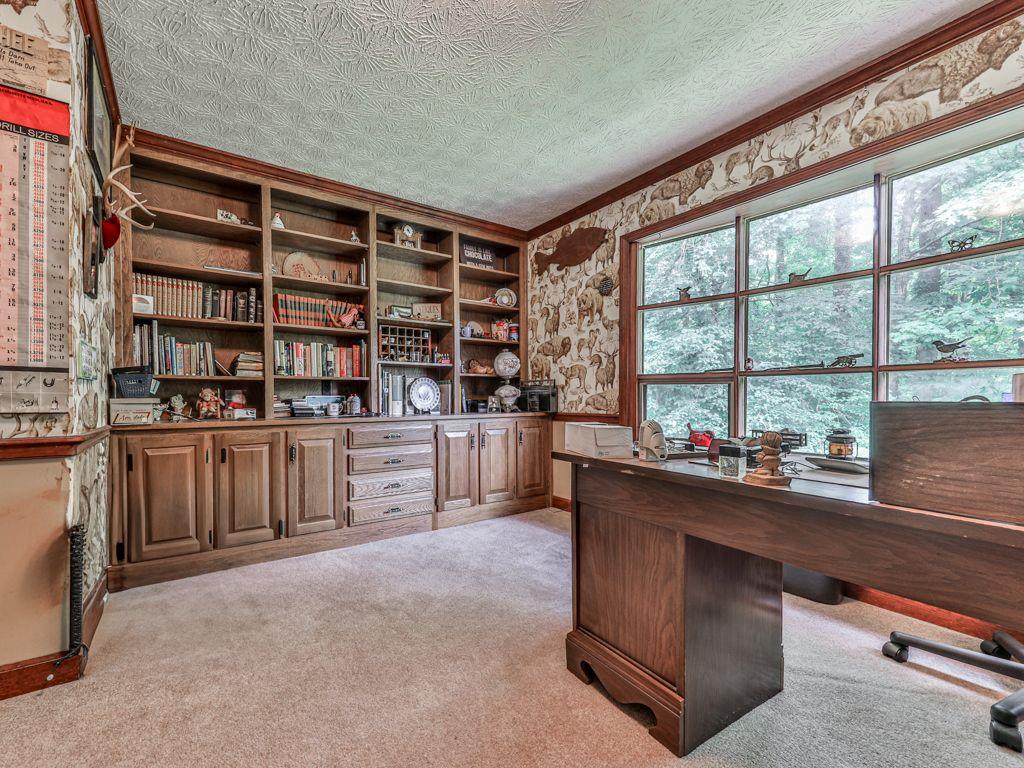2760 Hembree Road Northeast Marietta, GA 30062 - Photo 22 of 65 a room with furniture a large window and shelf