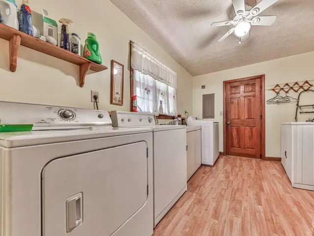 a kitchen with stainless steel appliances granite countertop a stove top oven sink and cabinets