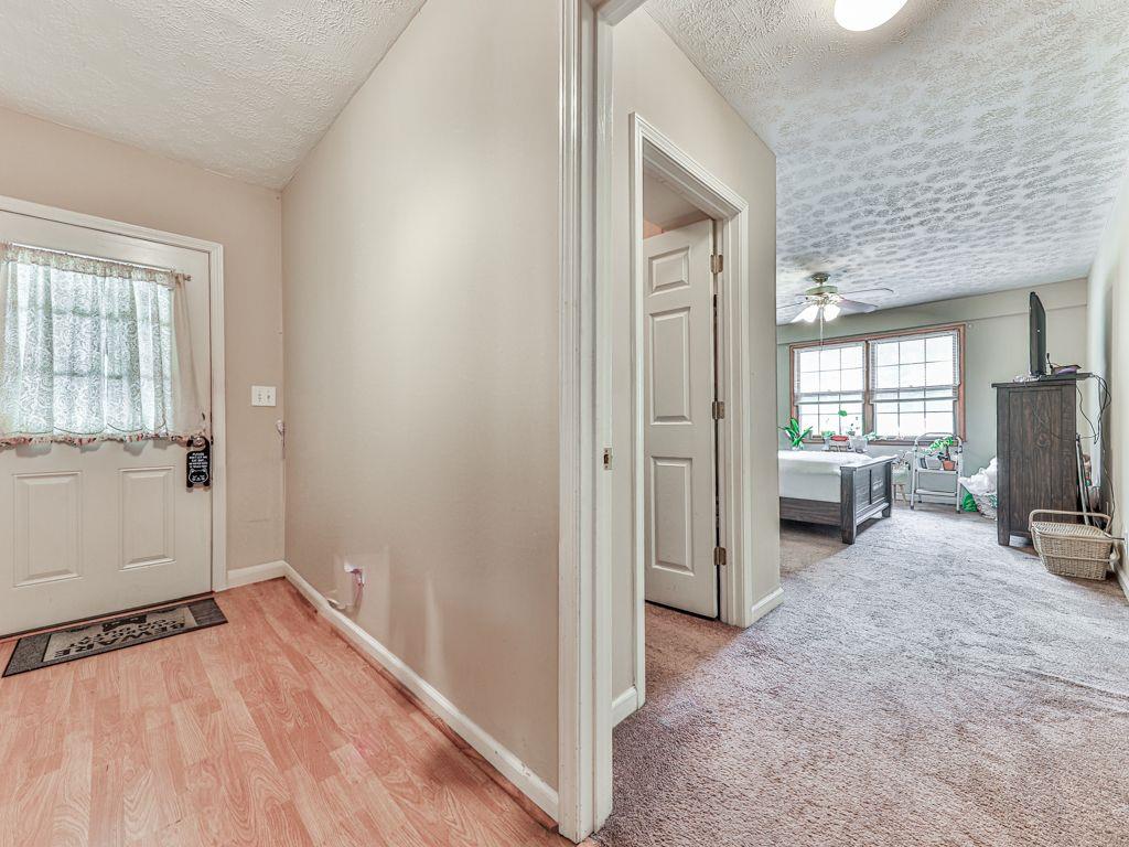 2760 Hembree Road Northeast Marietta, GA 30062 - Photo 36 of 65 a view of a bedroom with a bed and wooden floor