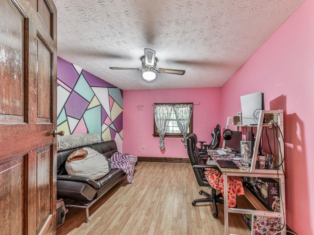2760 Hembree Road Northeast Marietta, GA 30062 - Photo 42 of 65 a living room with lots of furniture and gym equipment