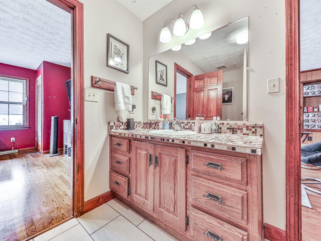 2760 Hembree Road Northeast Marietta, GA 30062 - Photo 45 of 65 a bathroom with a sink vanity and a mirror