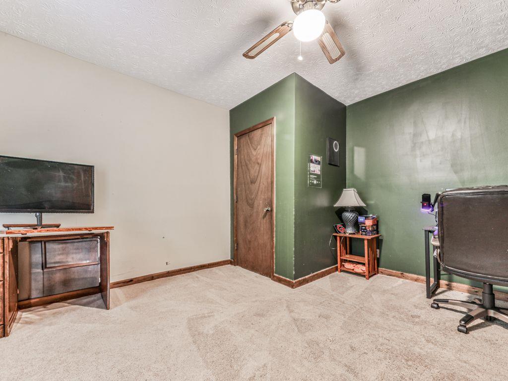 2760 Hembree Road Northeast Marietta, GA 30062 - Photo 46 of 65 a view of a livingroom with furniture and a flat screen tv