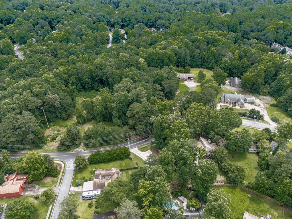 2760 Hembree Road Northeast Marietta, GA 30062 - Photo 49 of 65 an aerial view of residential houses with outdoor space and trees all around