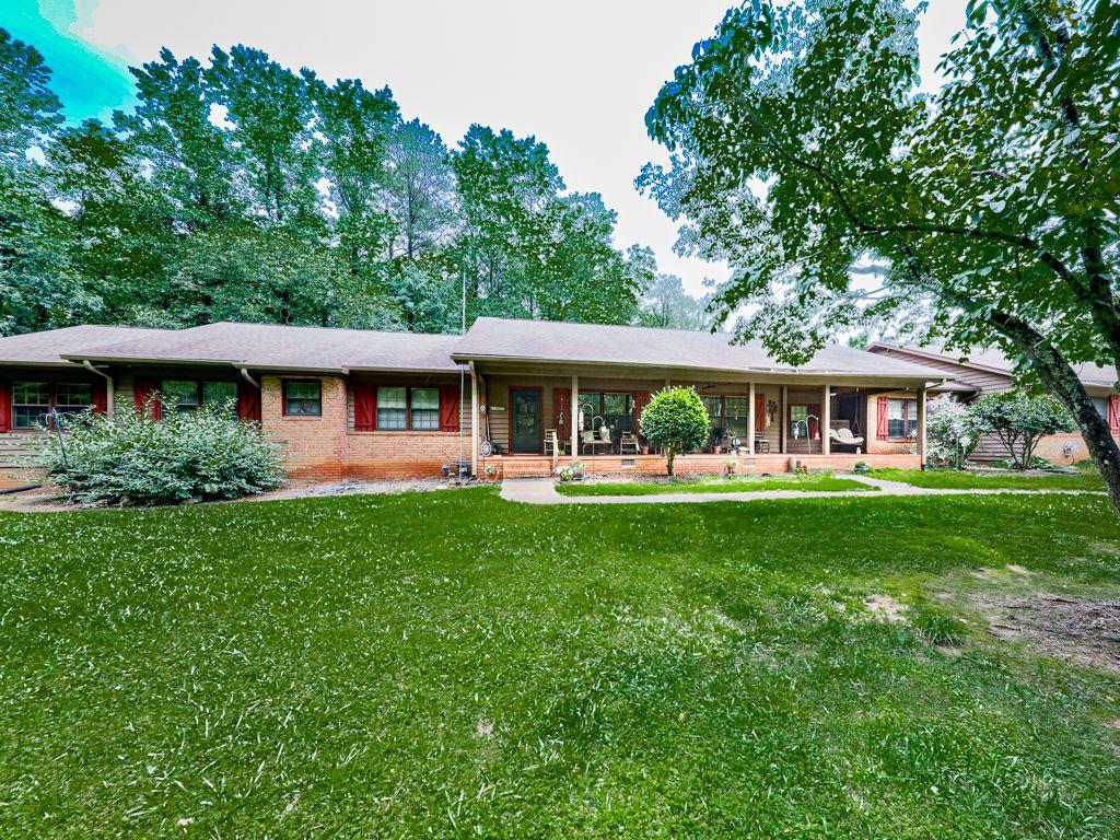 2760 Hembree Road Northeast Marietta, GA 30062 - Photo 5 of 65 a front view of a house with a yard