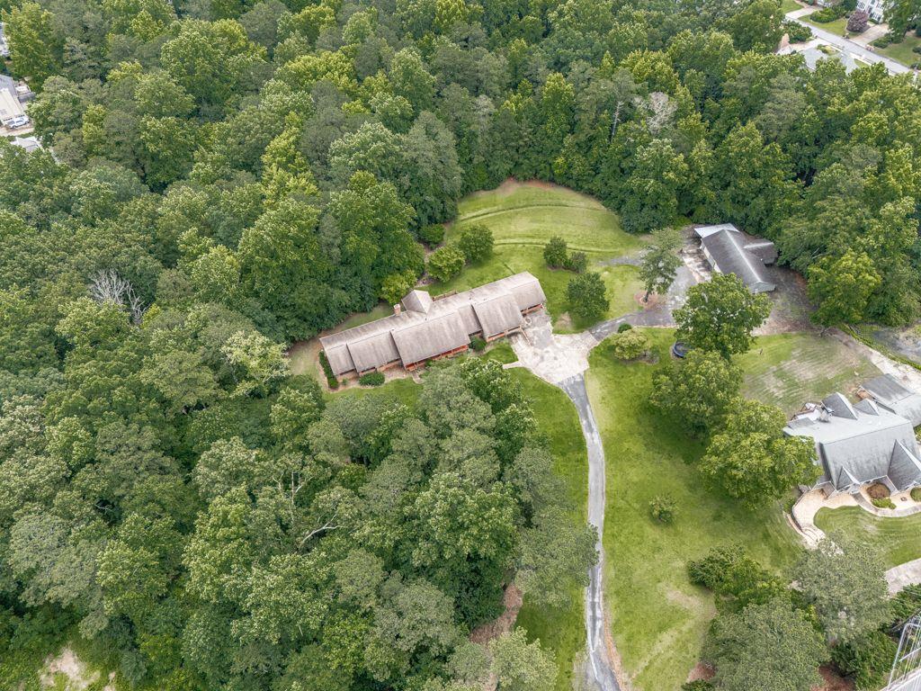 2760 Hembree Road Northeast Marietta, GA 30062 - Photo 53 of 65 a backyard of a house with lots of green space