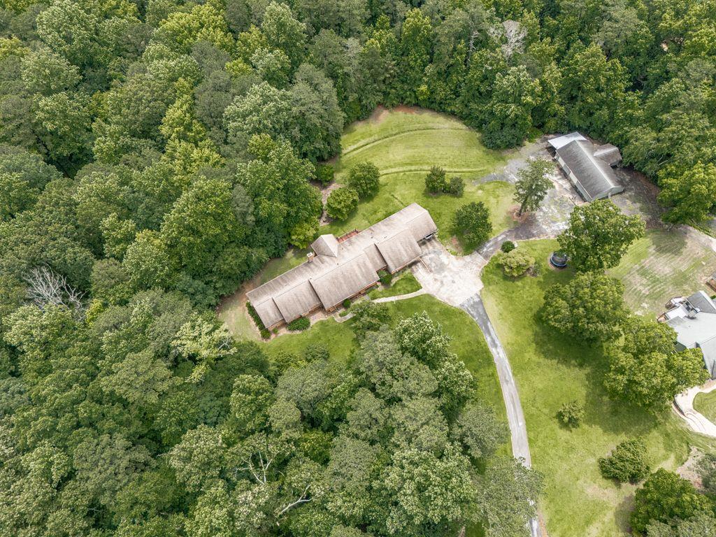 2760 Hembree Road Northeast Marietta, GA 30062 - Photo 61 of 65 an aerial view of a house with a yard and swimming pool