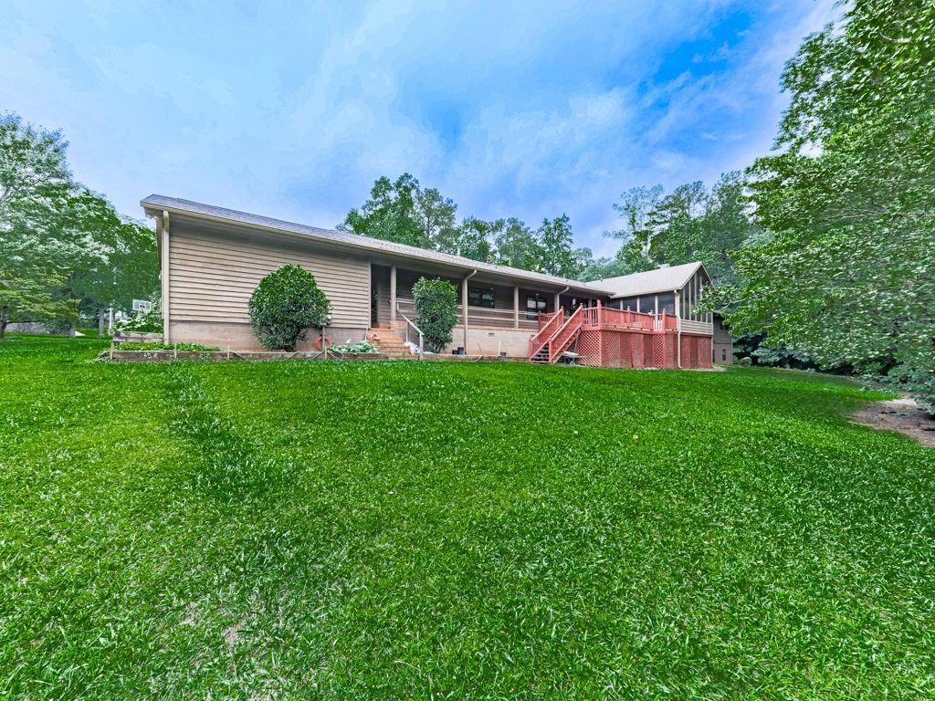 2760 Hembree Road Northeast Marietta, GA 30062 - Photo 8 of 65 a view of a house with backyard and sitting area