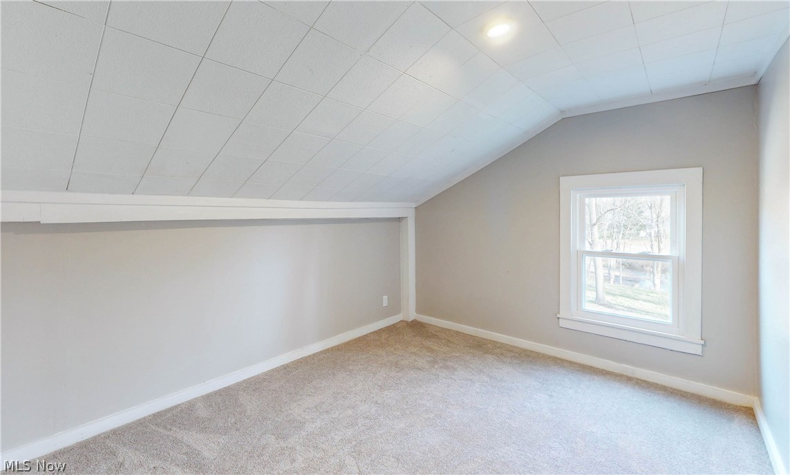 2081 Stroup Road Atwater, OH 44201 - Photo 44 of 48 Bonus room featuring light carpet and lofted ceiling