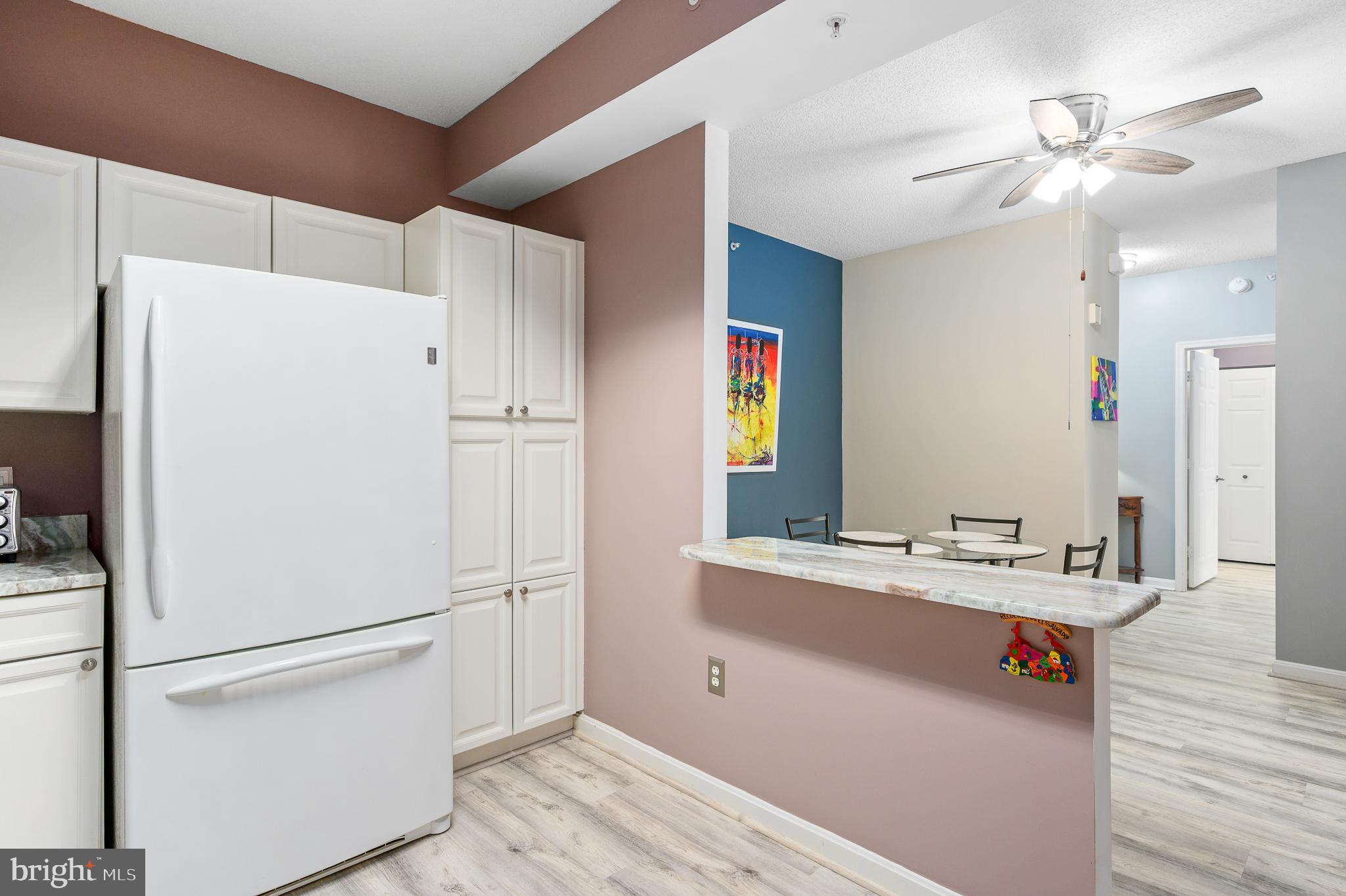 19355 Cypress Ridge Terrace, Unit 422 Leesburg, VA 20176 - Photo 13 of 34 Kitchen with pass through