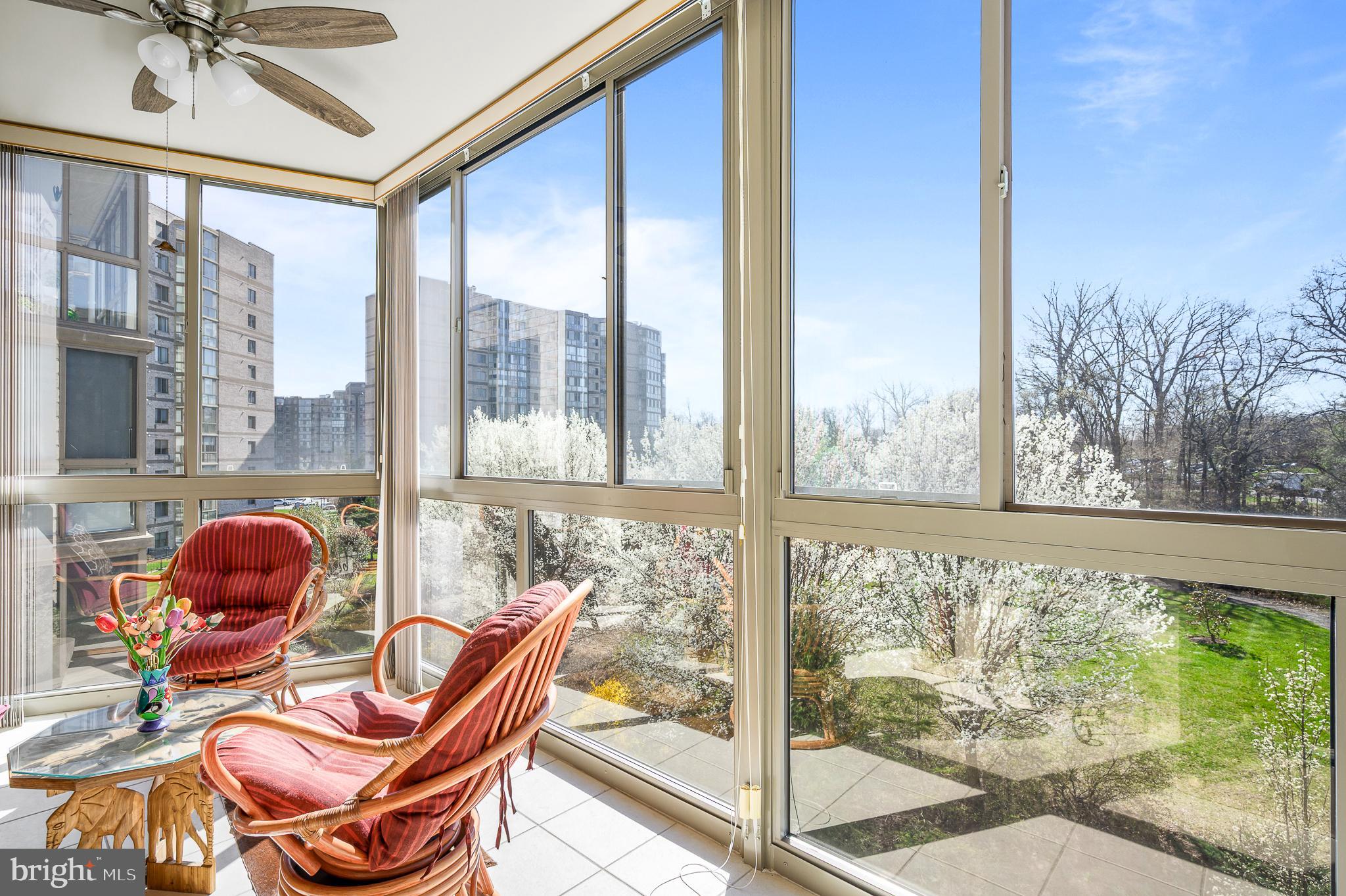 19355 Cypress Ridge Terrace, Unit 422 Leesburg, VA 20176 - Photo 6 of 34 Enjoy nature views on the sunroom