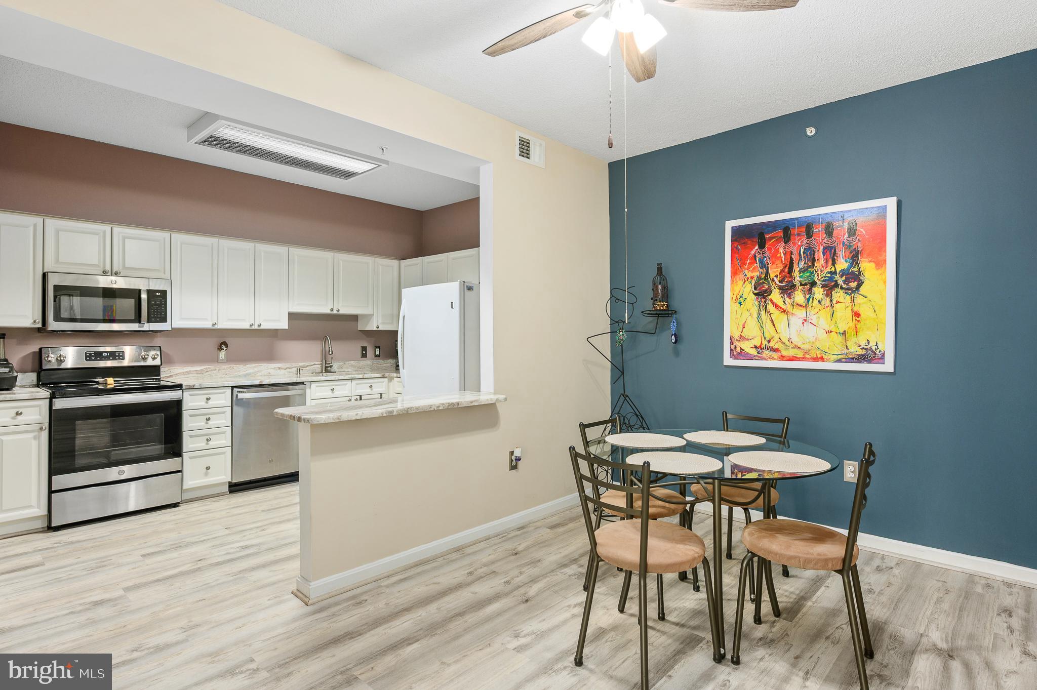 19355 Cypress Ridge Terrace, Unit 422 Leesburg, VA 20176 - Photo 9 of 34 Dining area open to kitchen