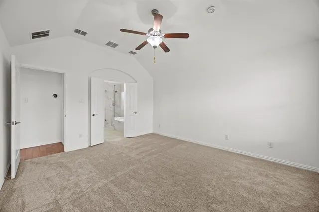 a view of a room with a ceiling fan
